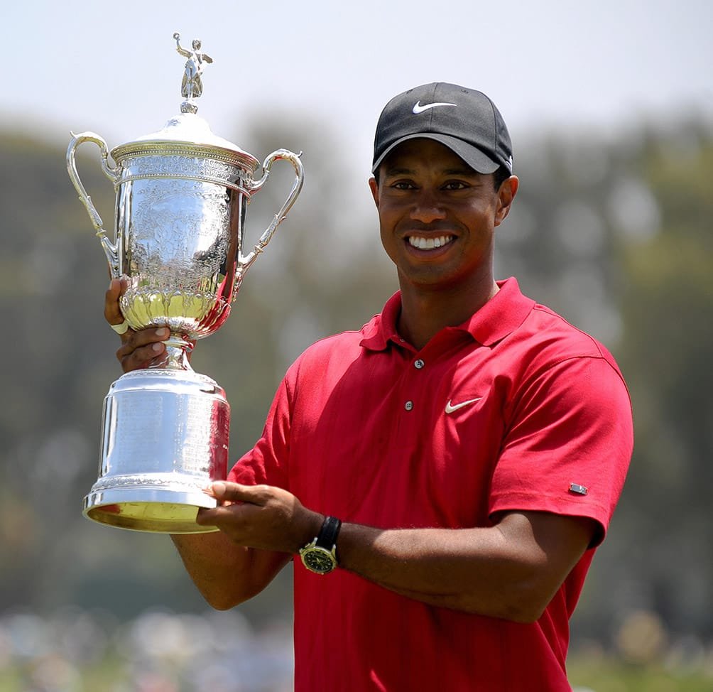 Championship golfer holding a trophy